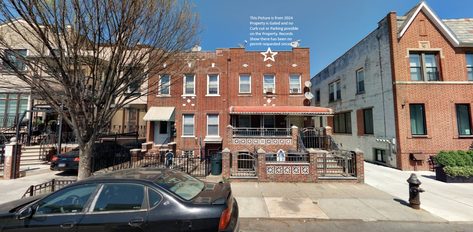 2024 image showing gated frontage with no visible curb cut or parking access